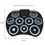 El tambor electrónico digital, rueda para arriba los kits del cojín de tambor construidos en altavoz 9 almohadilla el instrumento plegable portable de la práctica con 2 pedales del pie y el tambor pega el USB